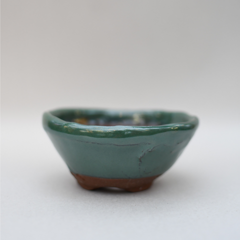 Textured green flared pot