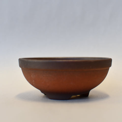 Round terra cotta and bronze pot